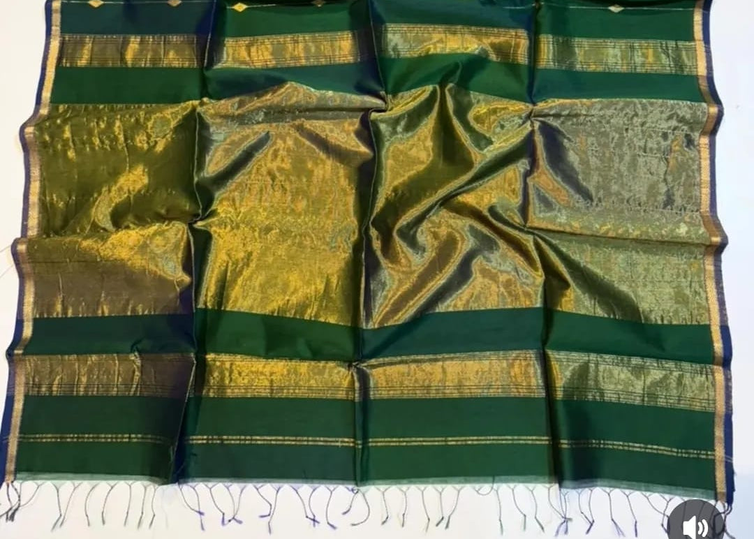 Green and gold fabric with a pattern on a white background