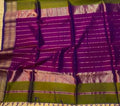 Purple and green traditional fabric with a checkered pattern