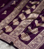 Purple fabric with intricate gold embroidery