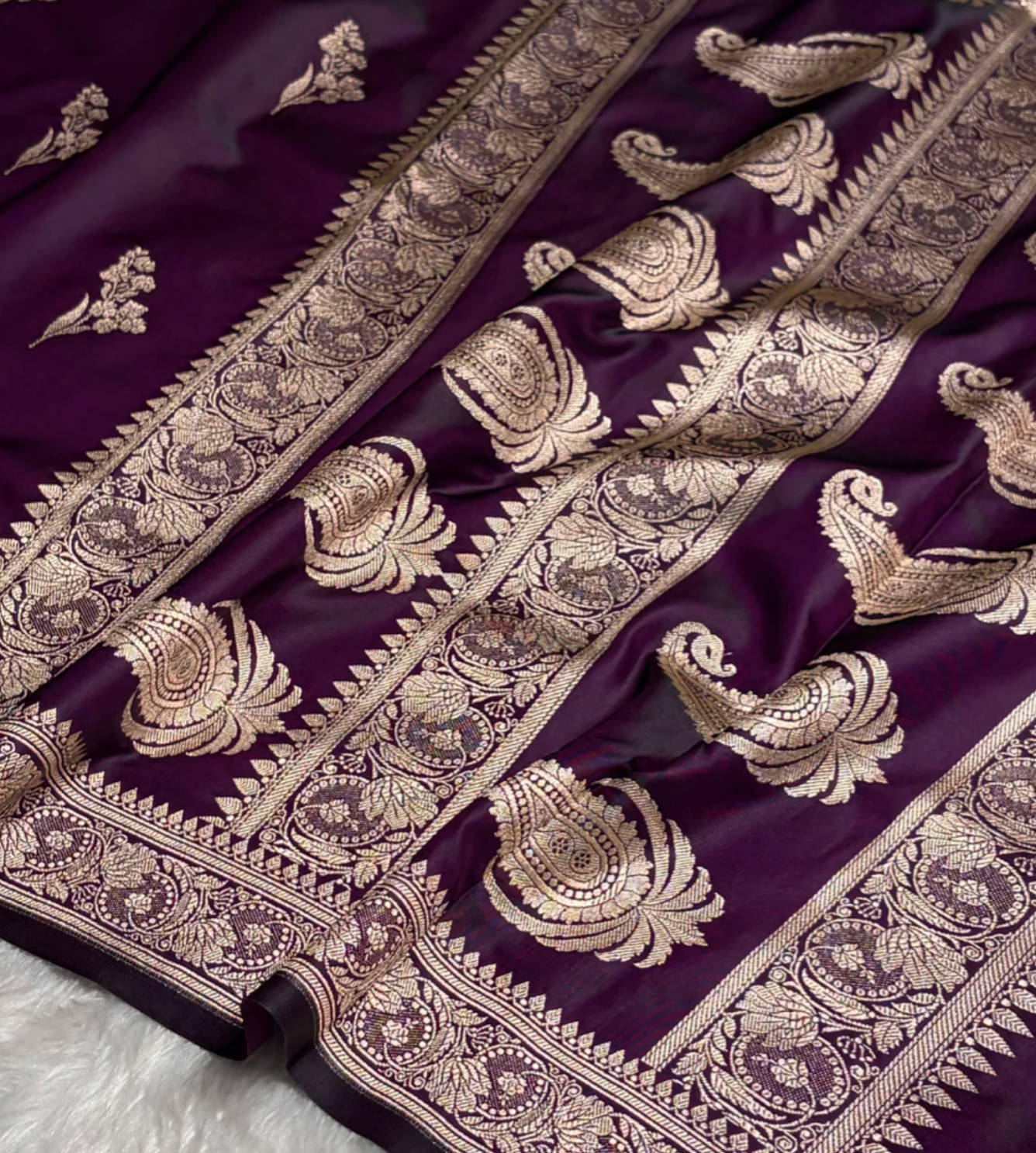 Purple fabric with intricate gold embroidery