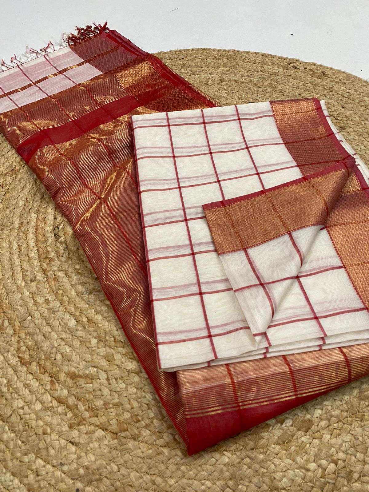 Red and white checkered fabric on a textured surface