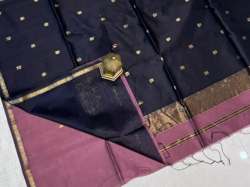 Navy blue fabric with gold and brown border on a white background