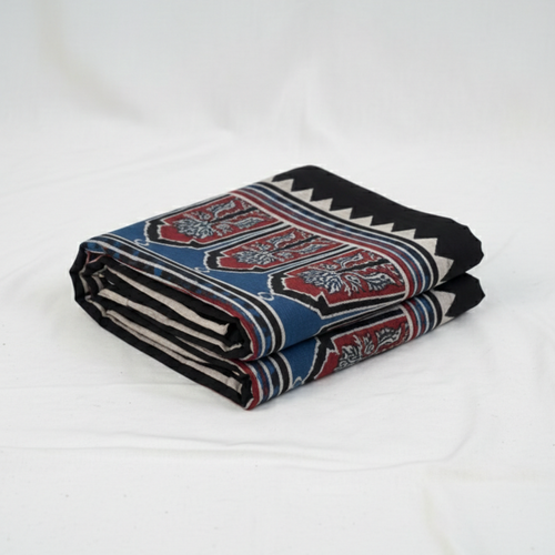 Folded blanket with a pattern on a white background