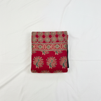 Red patterned fabric on a white background