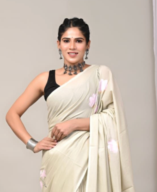 Woman drapped in beige saree