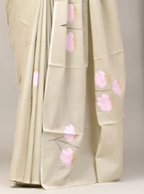 Light-colored fabric with pink floral embroidery on a neutral background