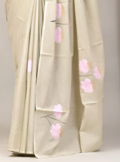 Light-colored fabric with pink floral embroidery on a neutral background