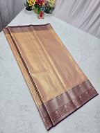 Beige saree with brown border on a light gray background
