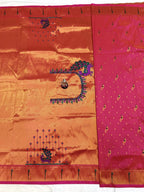 Saree with orange and pink fabric and decorative patterns on a white background