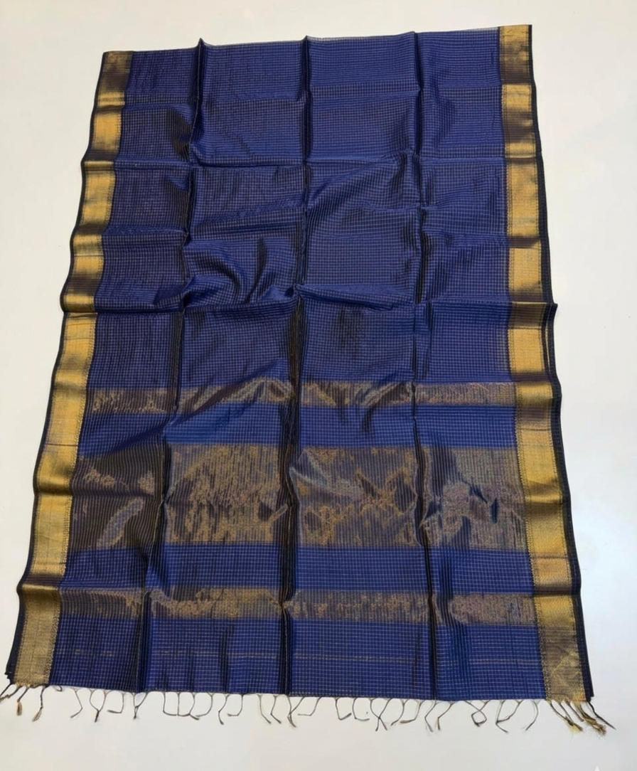 Blue and gold patterned fabric with fringes on a white background