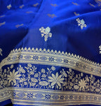 Blue fabric with white floral and geometric patterns