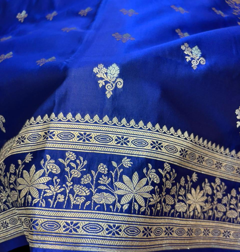 Blue fabric with white floral and geometric patterns