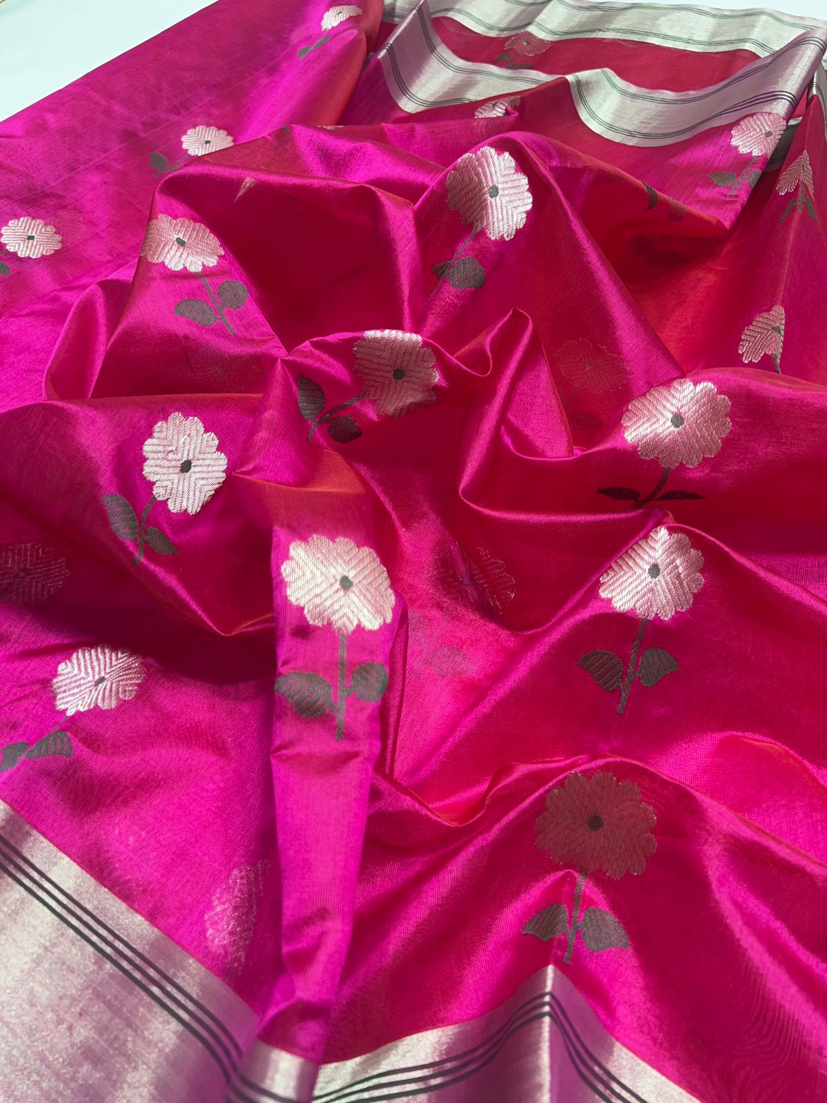 Close-up of a pink fabric with floral patterns