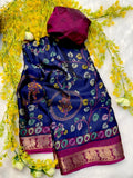 Blue saree with intricate patterns and a pink border on a white background with yellow flowers.