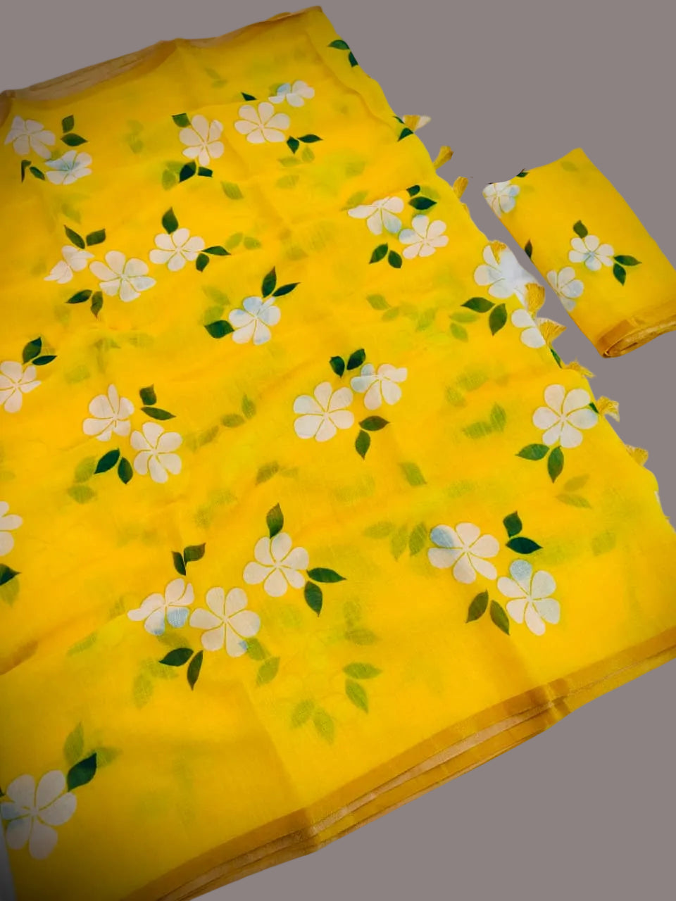 Yellow fabric with floral pattern on a white background