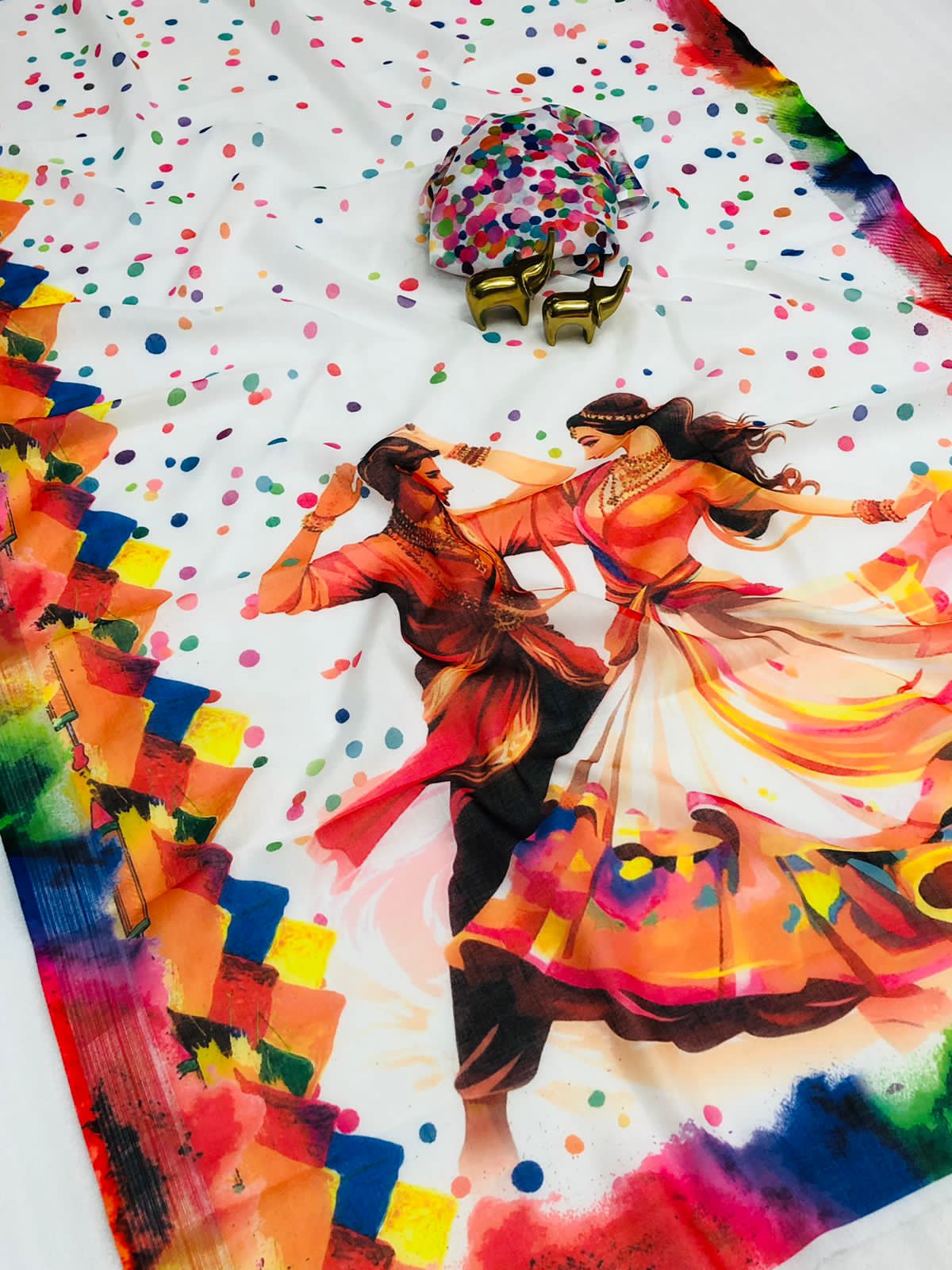 Colorful fabric with a painting of two dancers and confetti