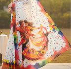 Woman wearing a colorful saree with a scenic design outdoors