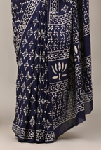 Navy blue fabric with white geometric patterns on a neutral background
