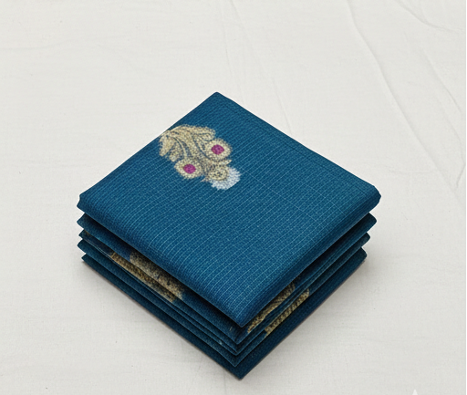 Blue saree with gold patterns on a mannequin and flat surface