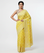 Woman wearing a yellow saree with a white background