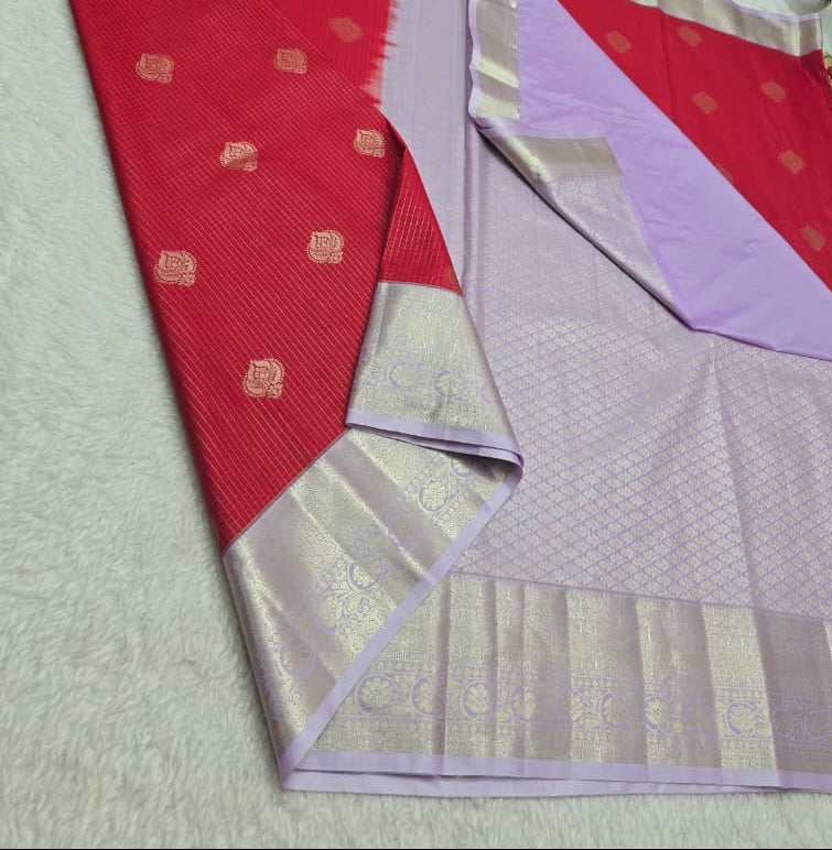 Red and purple saree with gold patterns on a white background