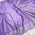 Purple fabric with intricate silver border