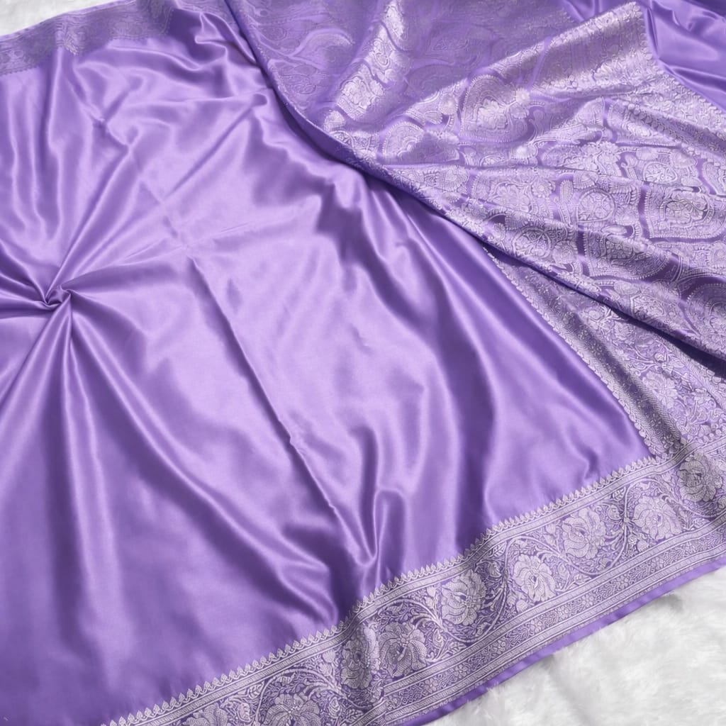 Purple fabric with intricate silver border
