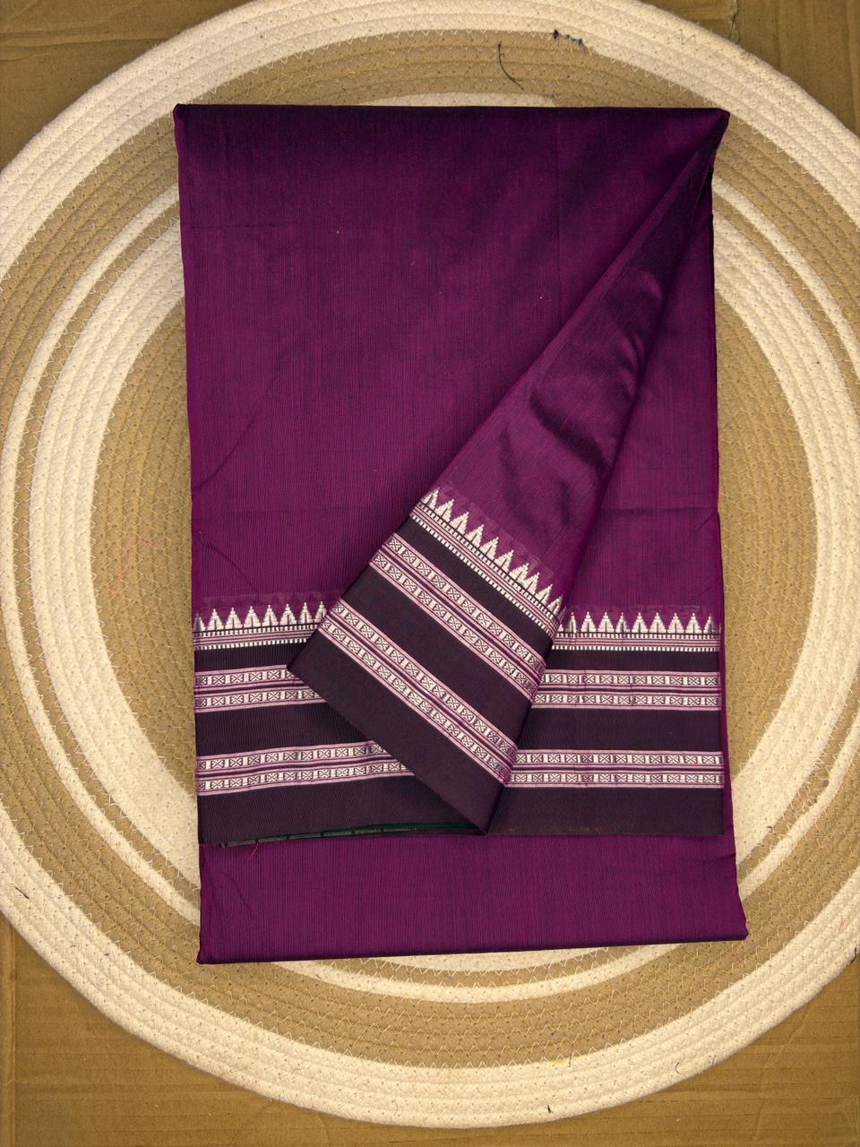 Purple fabric with white patterns on a circular wooden surface