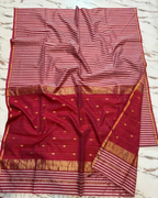 Red and white checkered fabric with a border on a marble surface