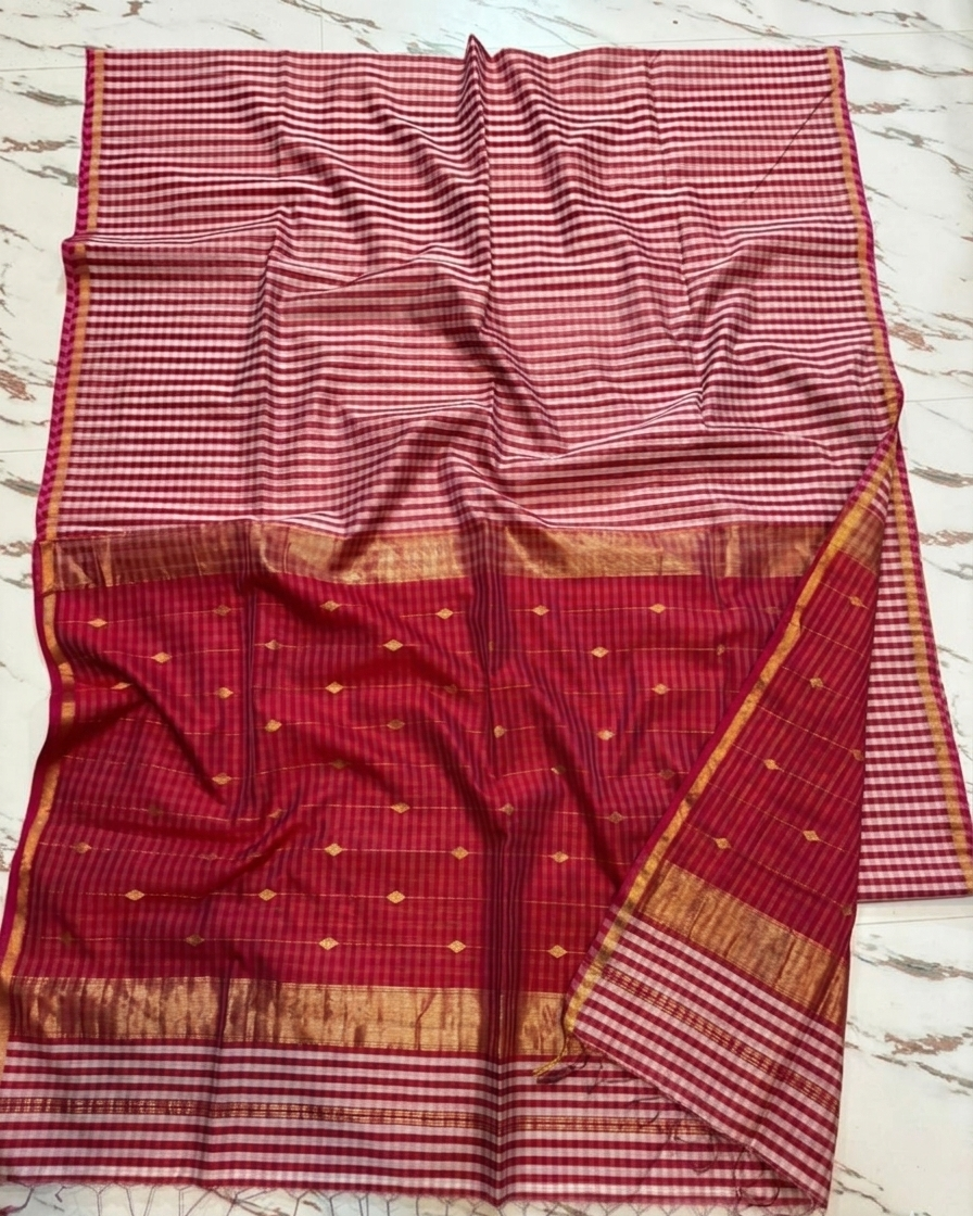 Red and white checkered fabric with a border on a marble surface