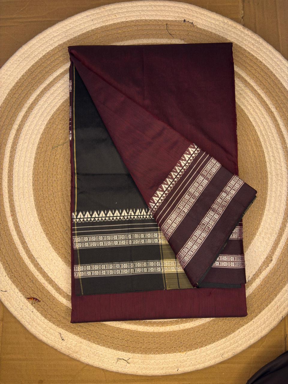 Folded fabric with geometric patterns on a circular wooden surface