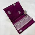 Purple fabric with white patterns and designs on a white background
