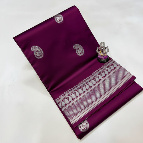 Purple fabric with white patterns and designs on a white background