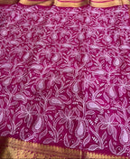 Pink fabric with white floral patterns and gold border