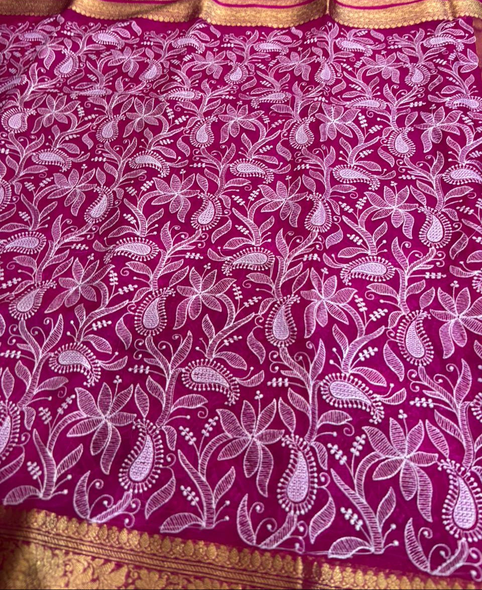Pink fabric with white floral patterns and gold border
