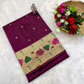 Purple saree with floral patterns on a white background
