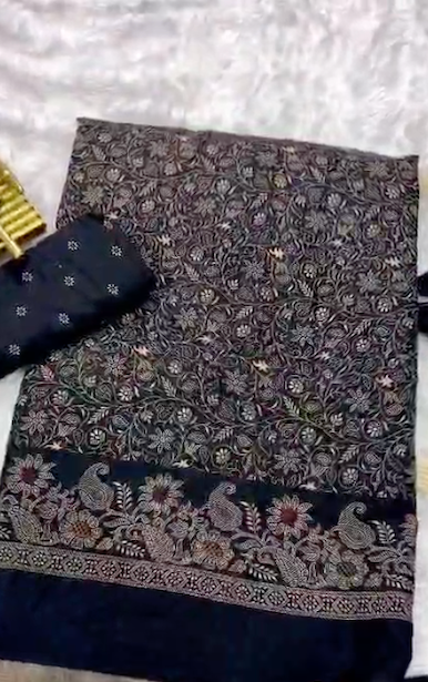 Black and gold patterned fabric with a floral design on a white background