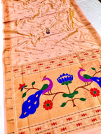 Decorative fabric with peacock and floral patterns on a peach background