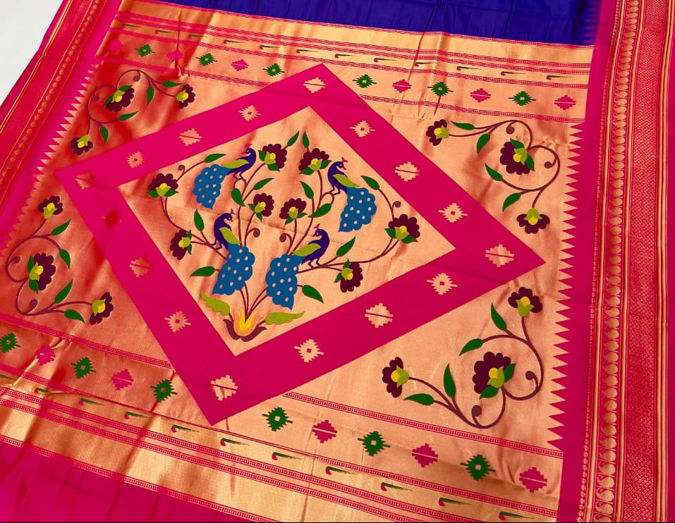 Colorful saree with intricate patterns on a plain background