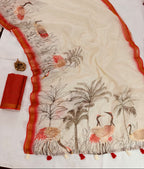 Embroidered fabric with bird and tree design on a white background