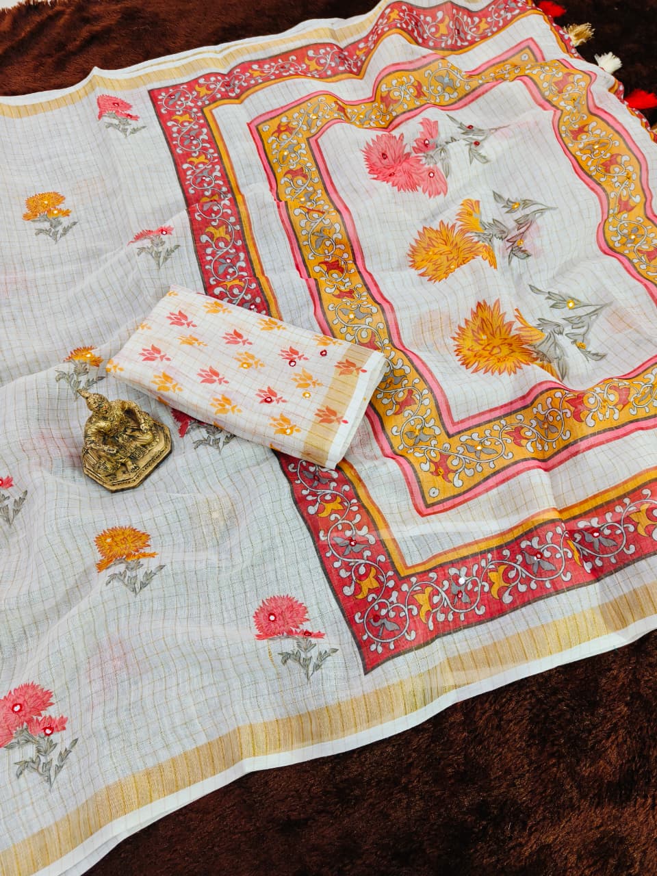 Decorative fabric with floral patterns on a brown surface