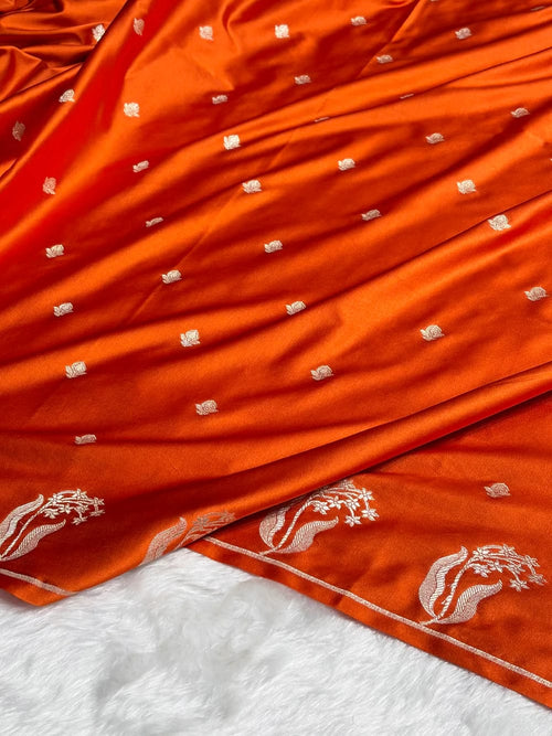 Orange fabric with white floral patterns on a white background