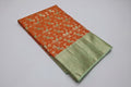 Saree with orange and green pattern on a white background