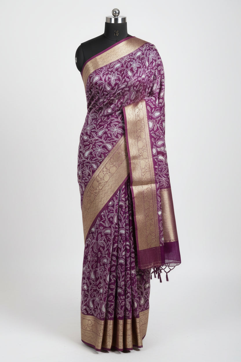 Purple saree with white floral patterns on a red and green checkered floor.