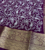 Purple fabric with white floral patterns and gold border