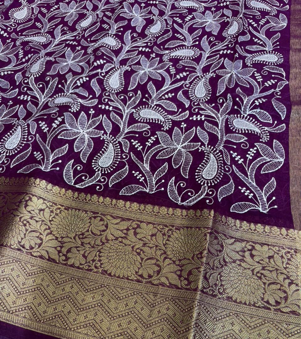 Purple fabric with white floral patterns and gold border