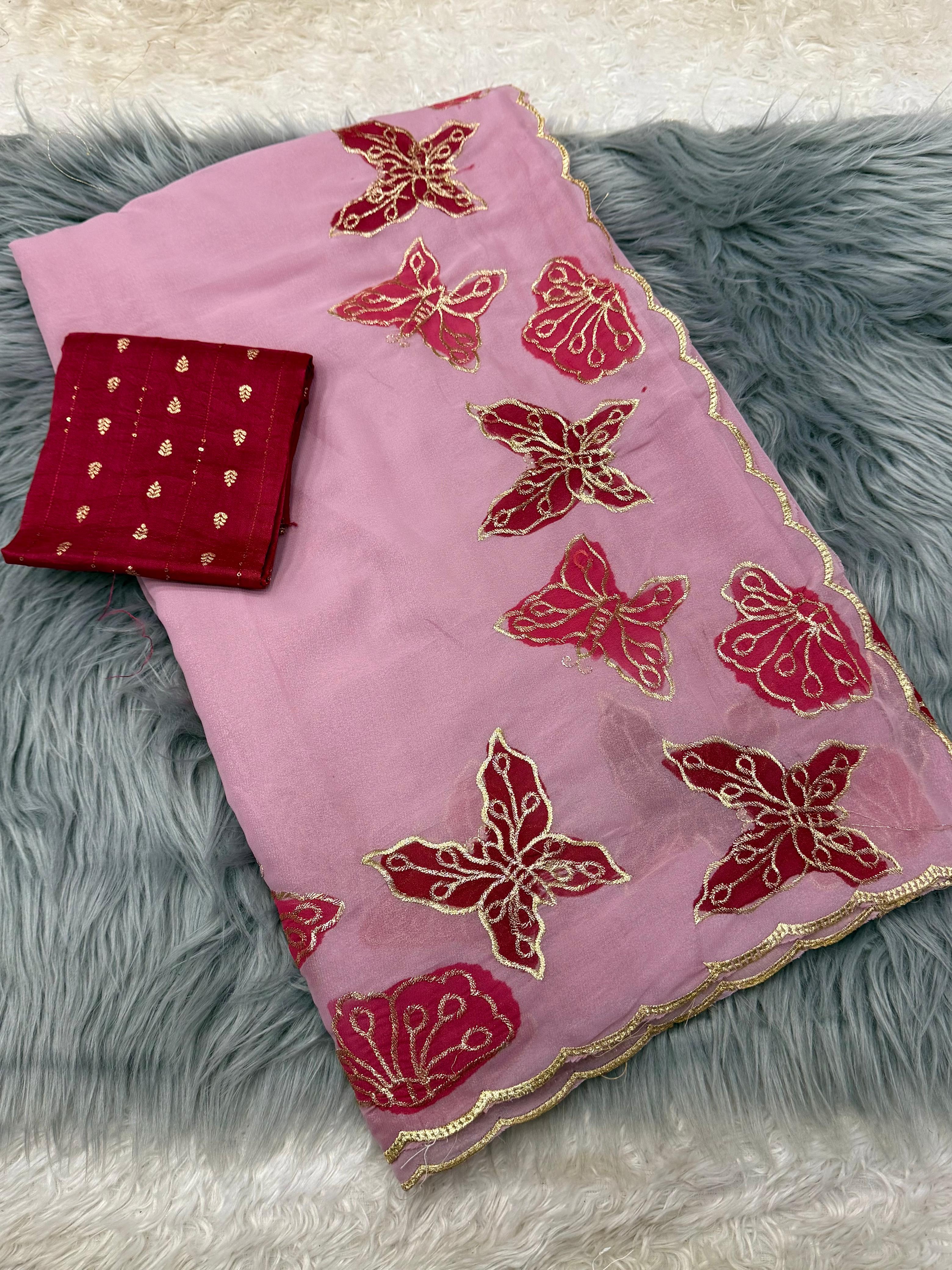 Pink fabric with red butterfly patterns on a gray textured surface