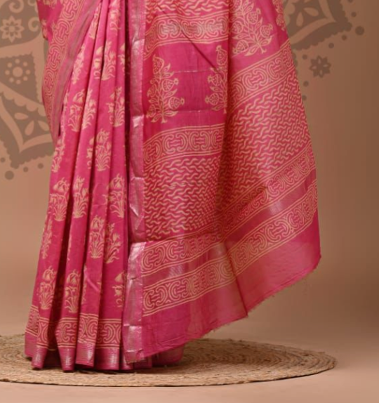 Pink saree with gold patterns on a beige background