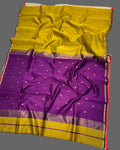 Purple and yellow saree with a floral decoration on a white background
