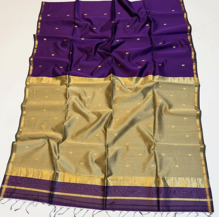 Purple and gold saree with a basket of flowers on a white background